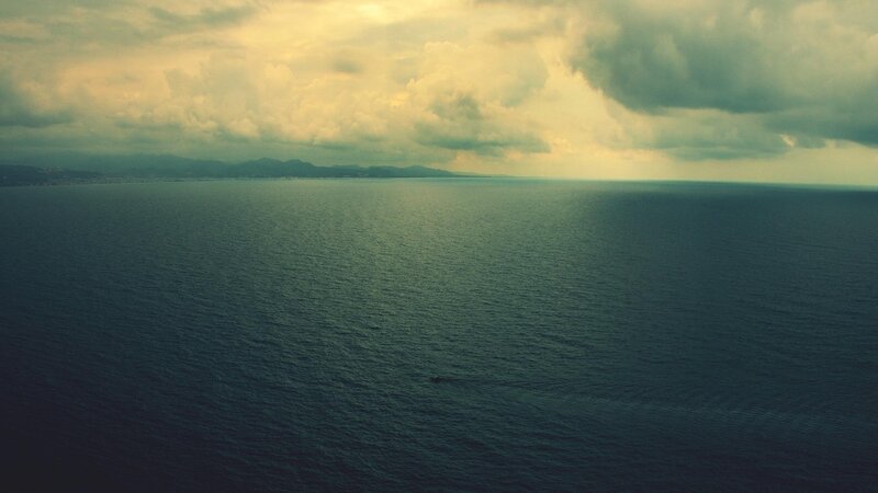 Ocean with Distant Land — Blue, Dramatic