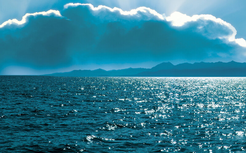 Ocean with Distant Mountains — Blue, Dramatic