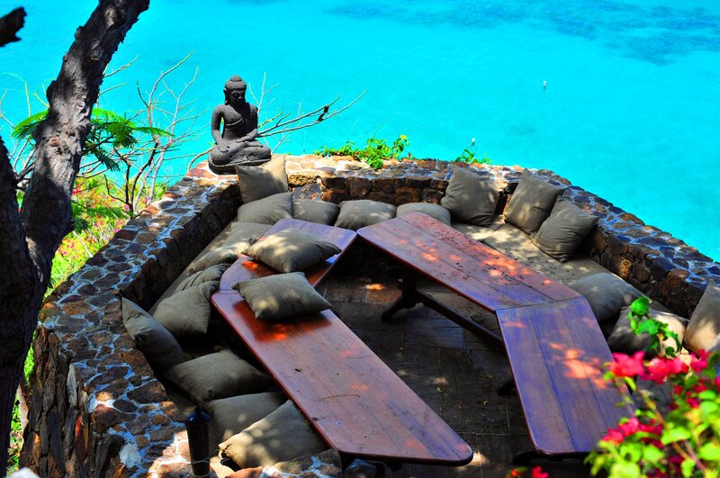Oceanfront seating with Buddha statue