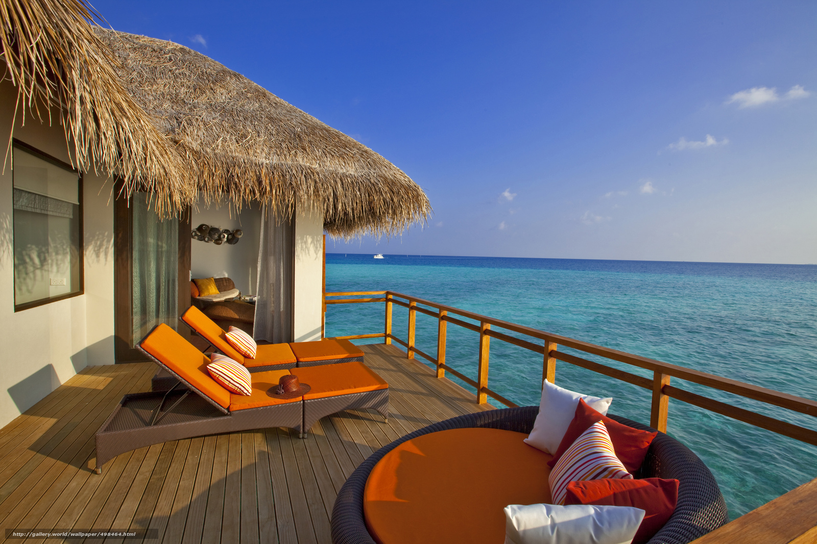 Oceanfront villa with lounge chairs