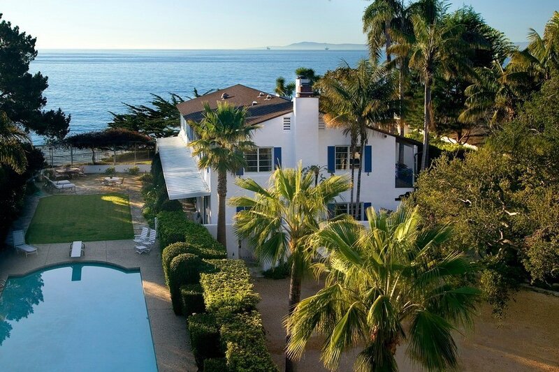 Oceanfront villa with pool and palm trees