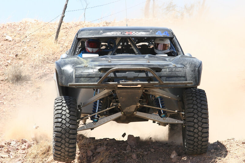 Off-road racing truck in action