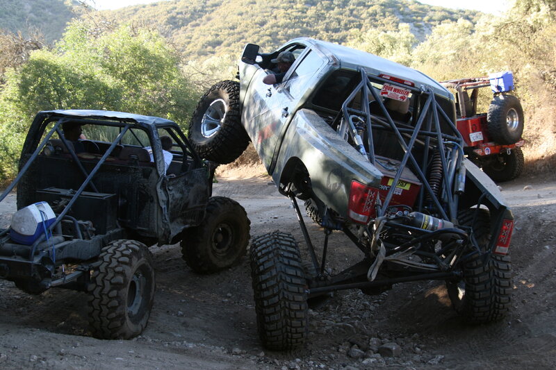 Off-road trucks on a dirt trail