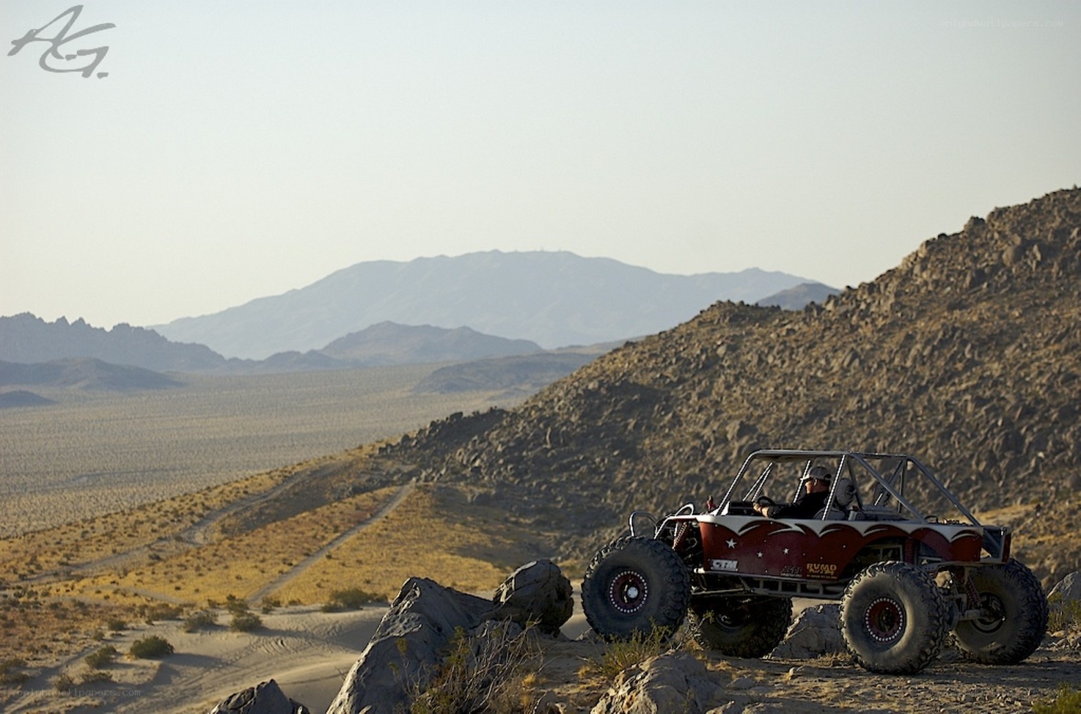 Off-road vehicle in desert landscape