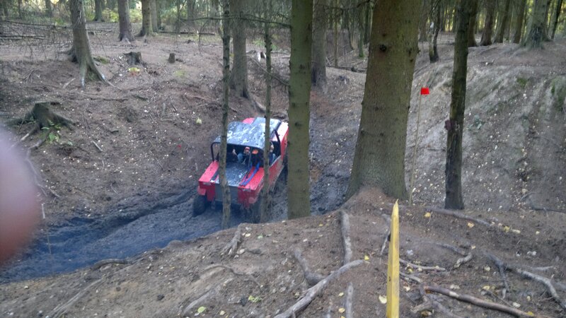 Off-road vehicle in forest mud