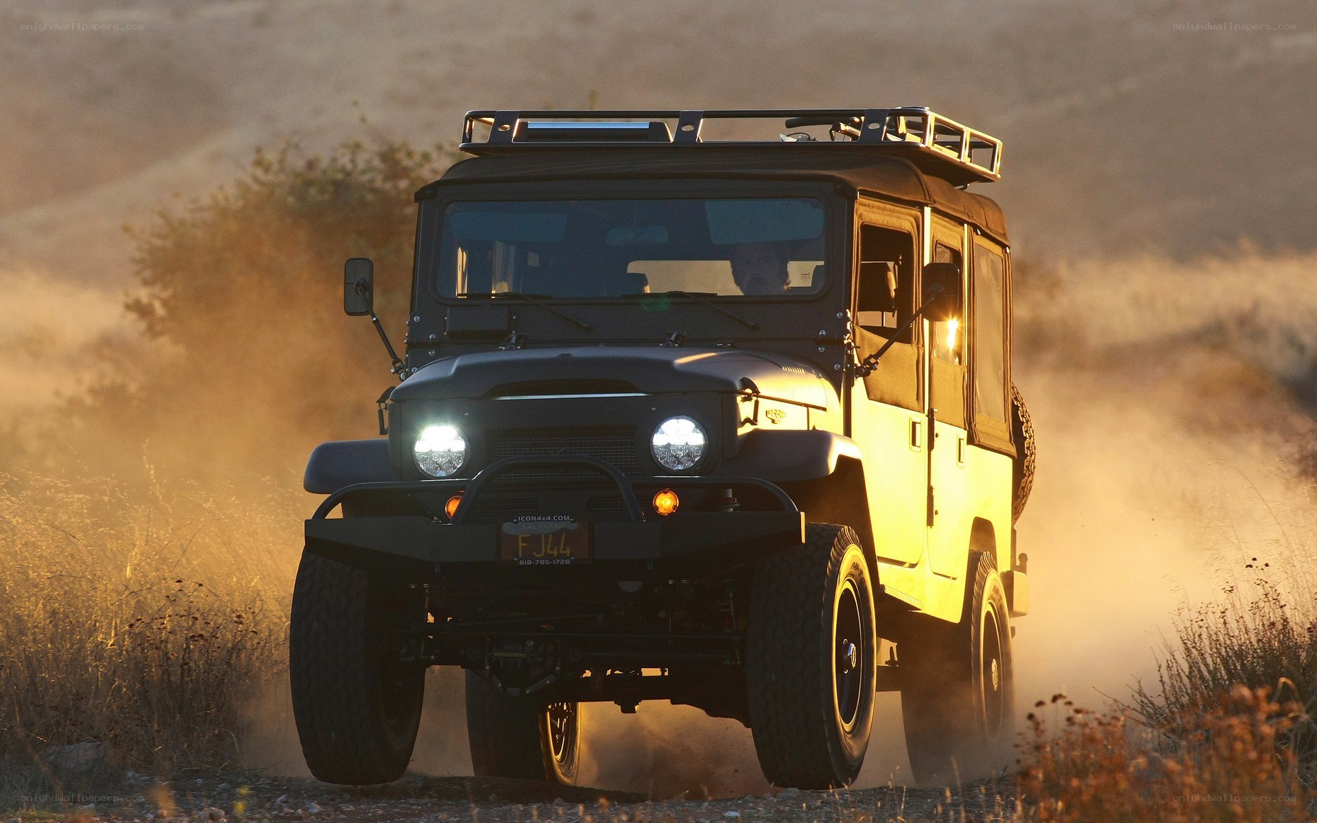 Off-road vehicle on dusty trail