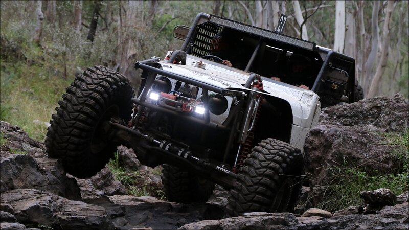 Off-road Vehicle on Rocks — White
