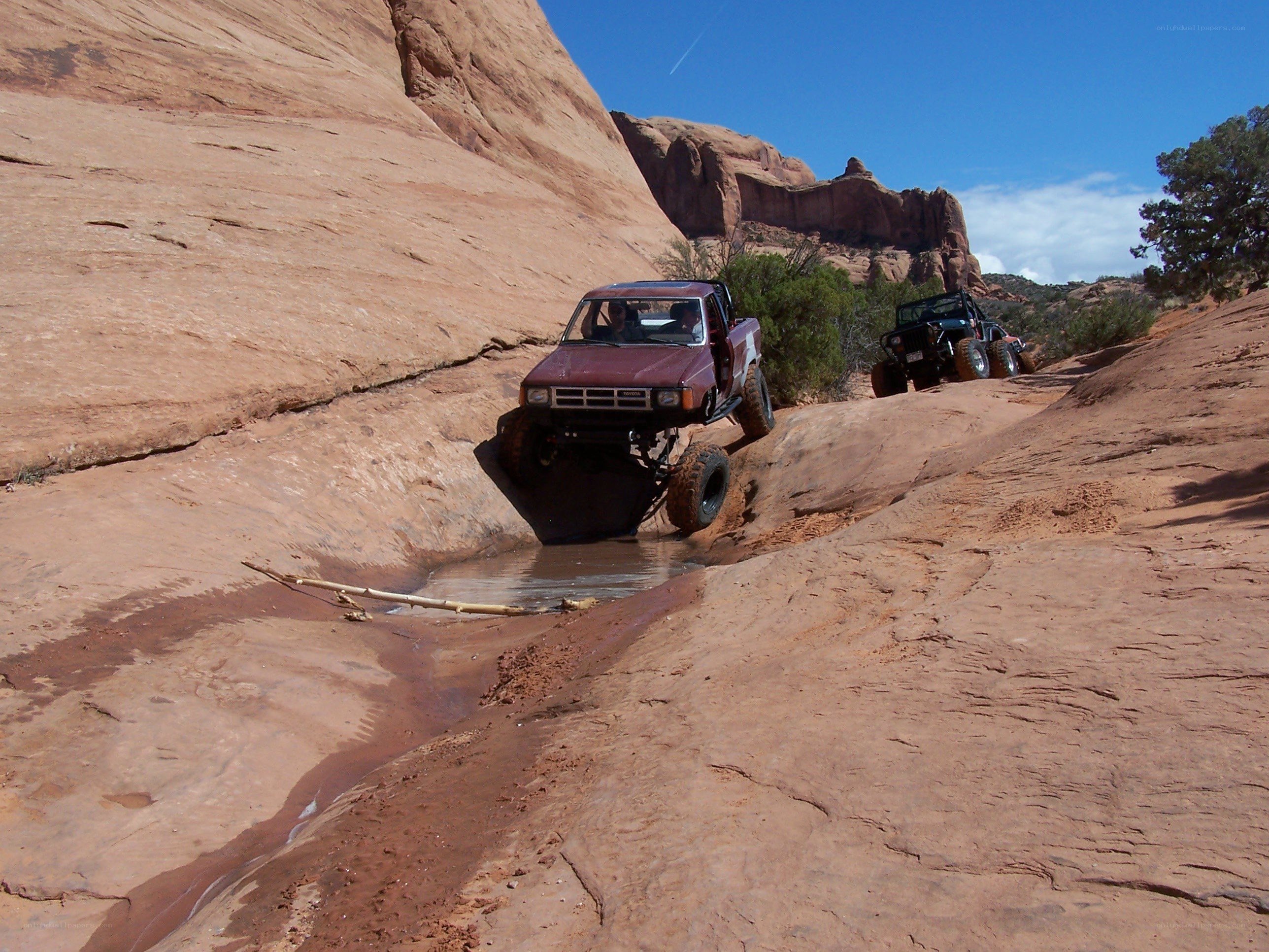 Off-road vehicles in desert canyon