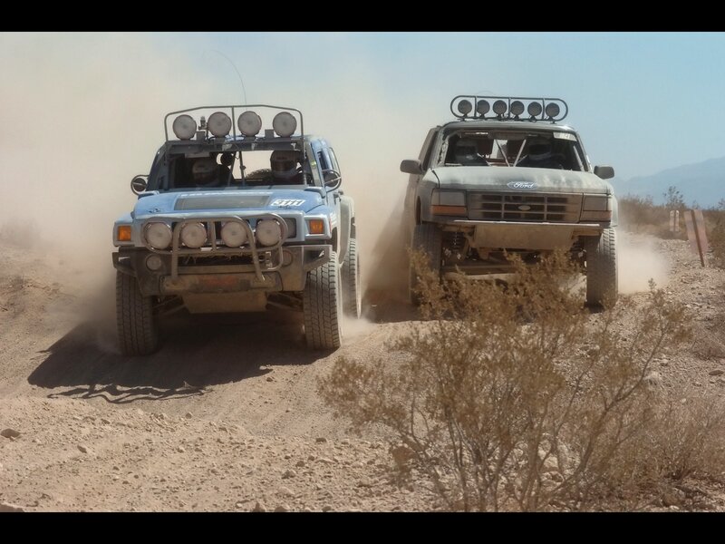 Off-road vehicles racing in desert