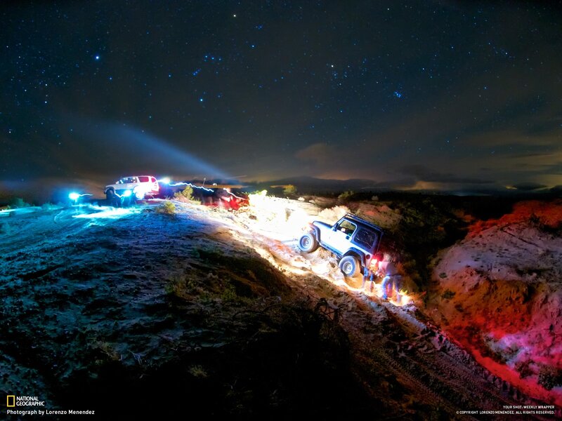 Off-road vehicles under starry sky