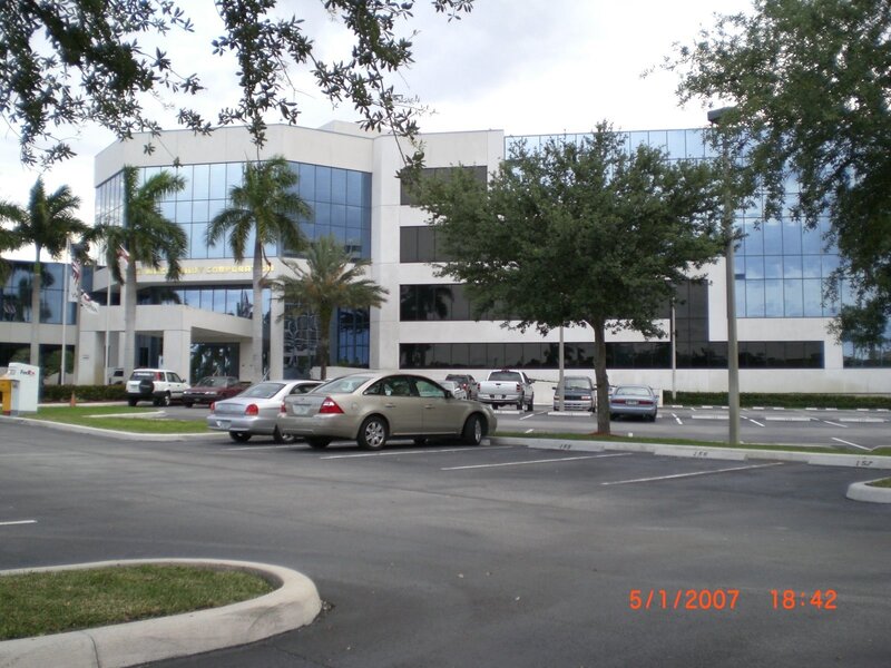 Office building with parked cars