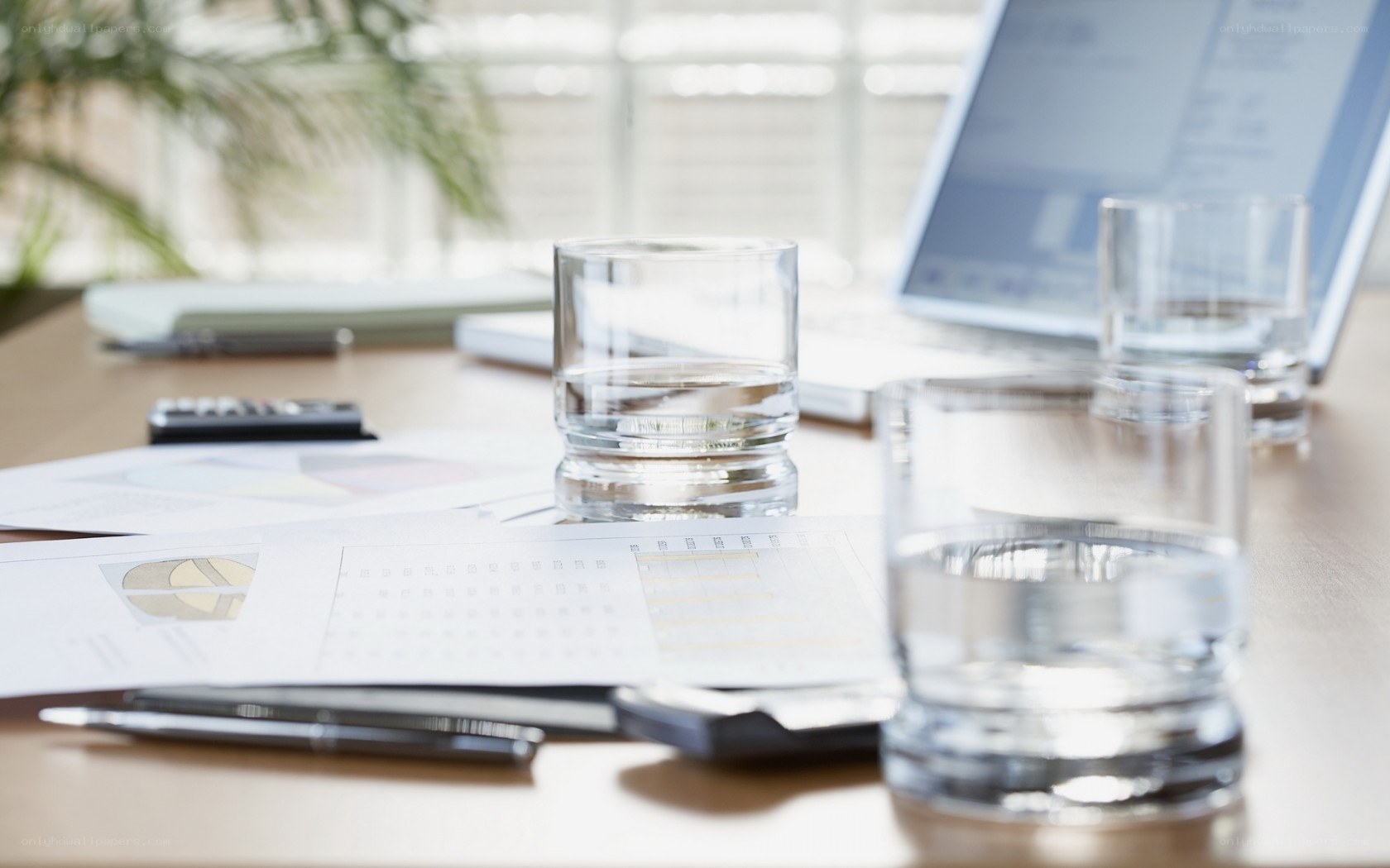 Office desk with documents and glasses