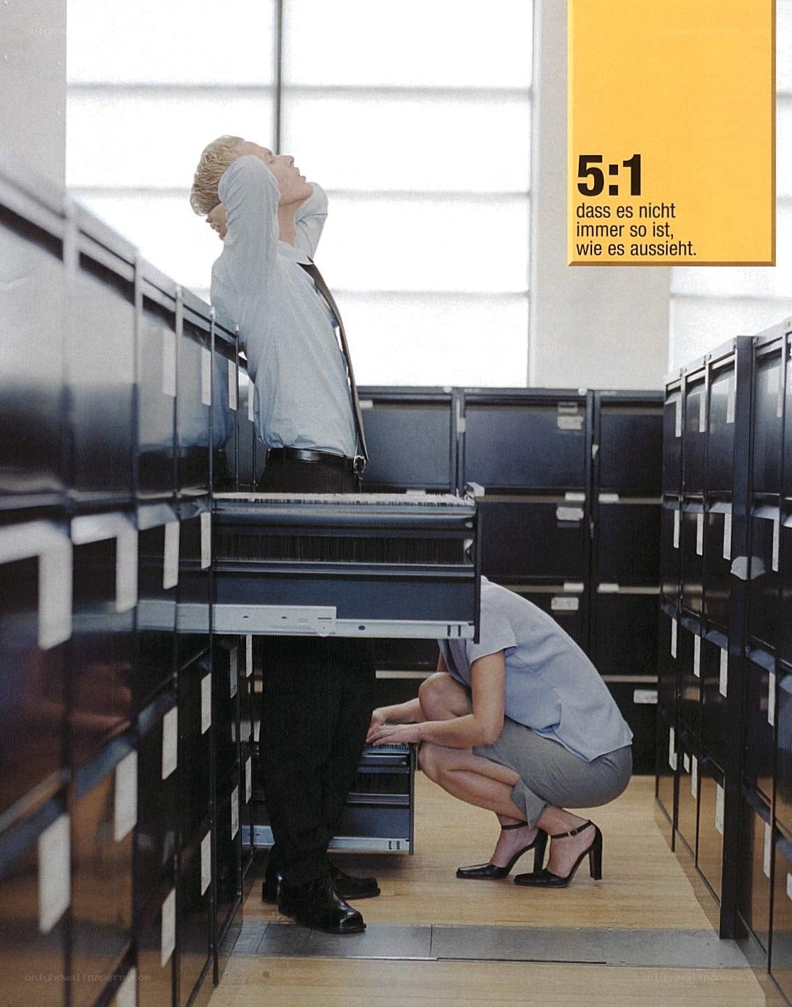 Office workers in filing room