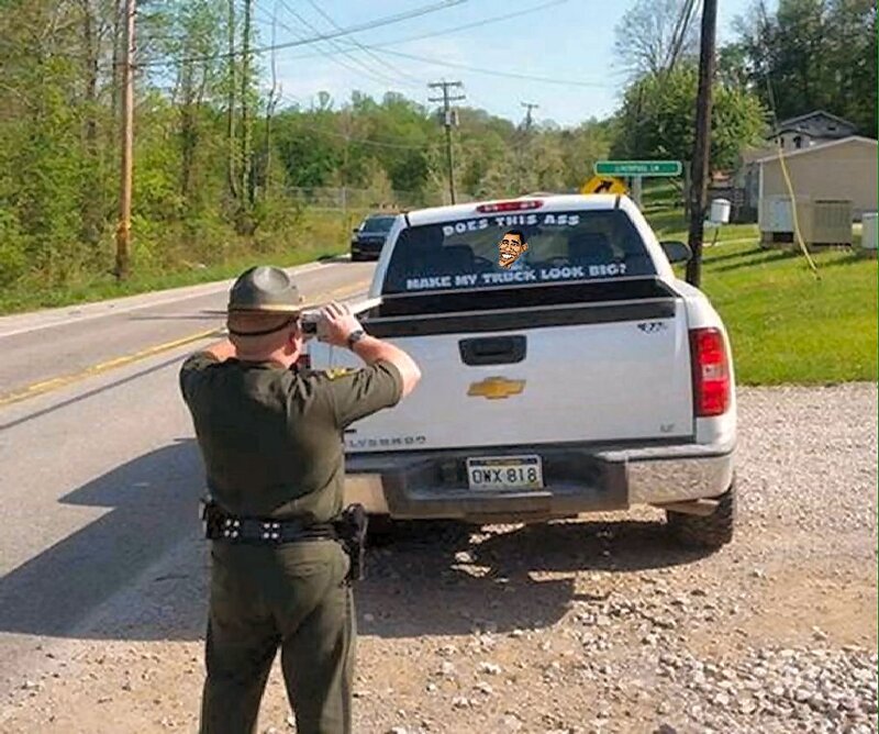 Officer Photographing Truck