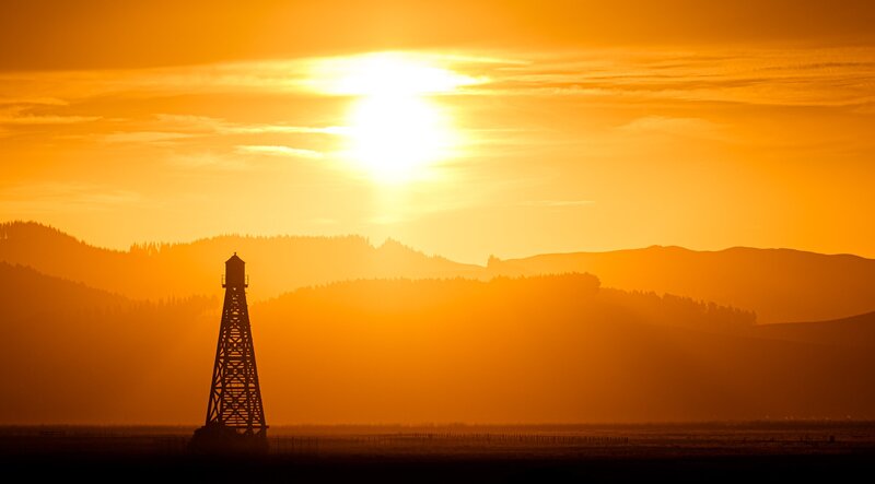 Oil Derrick at Sunset