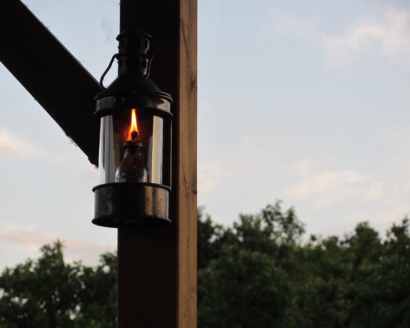 Oil Lamp on Wooden Post