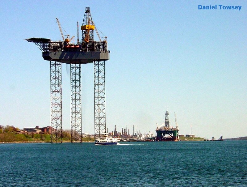 Oil rig and ferry on the water