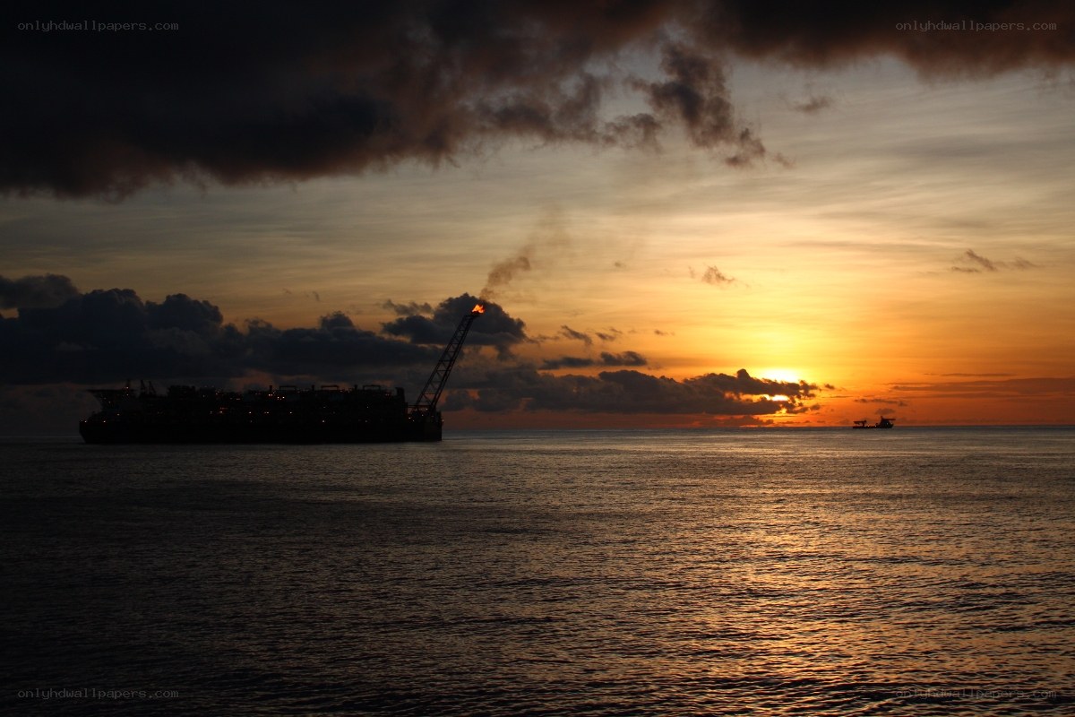 Oil rig at sunset