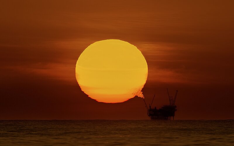 Oil Rig at Sunset — Orange, Dramatic, Photograph