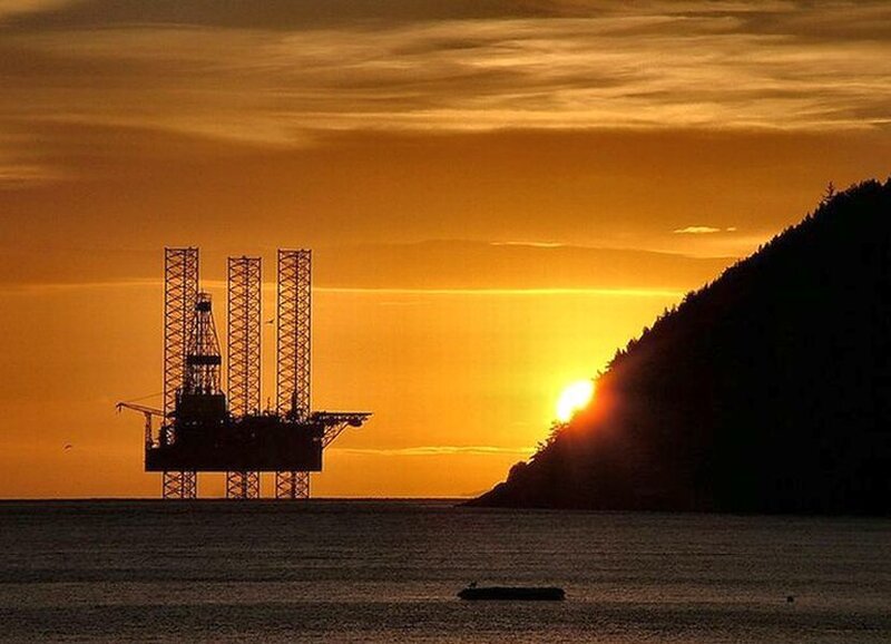 Oil Rig at Sunset — Orange, Dramatic