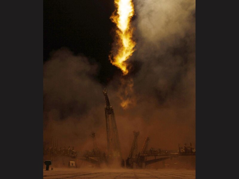 Oil rig fire at night