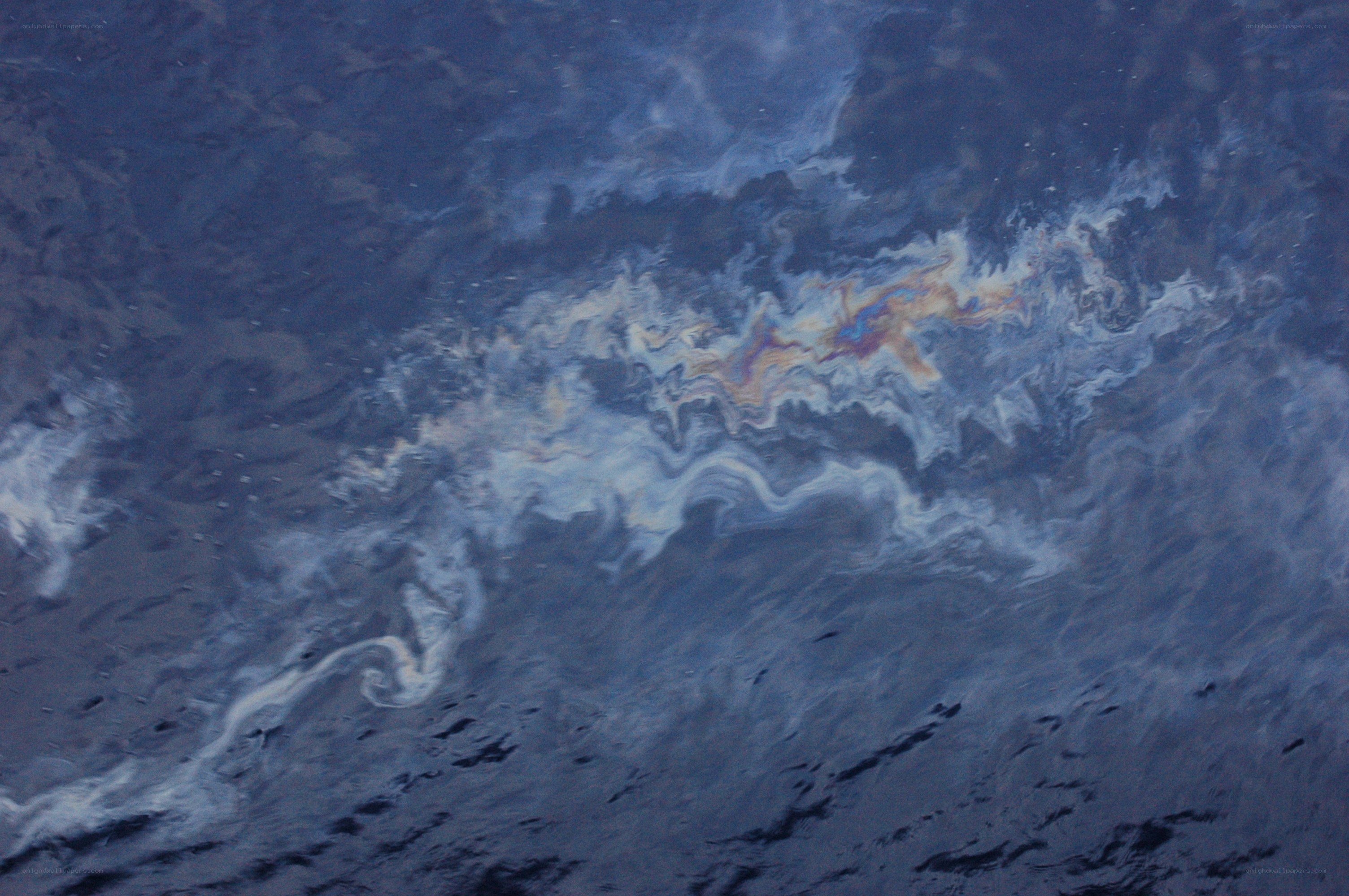 Oil slick on ocean surface