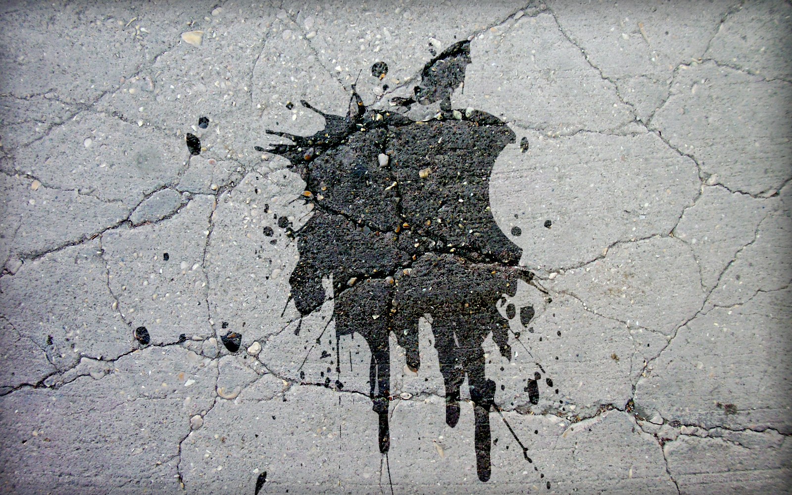 oil spill on cracked pavement