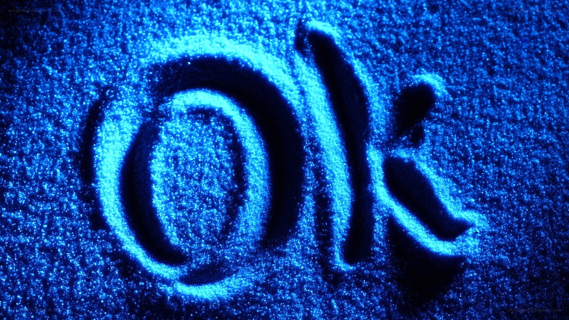 OK written in blue sand