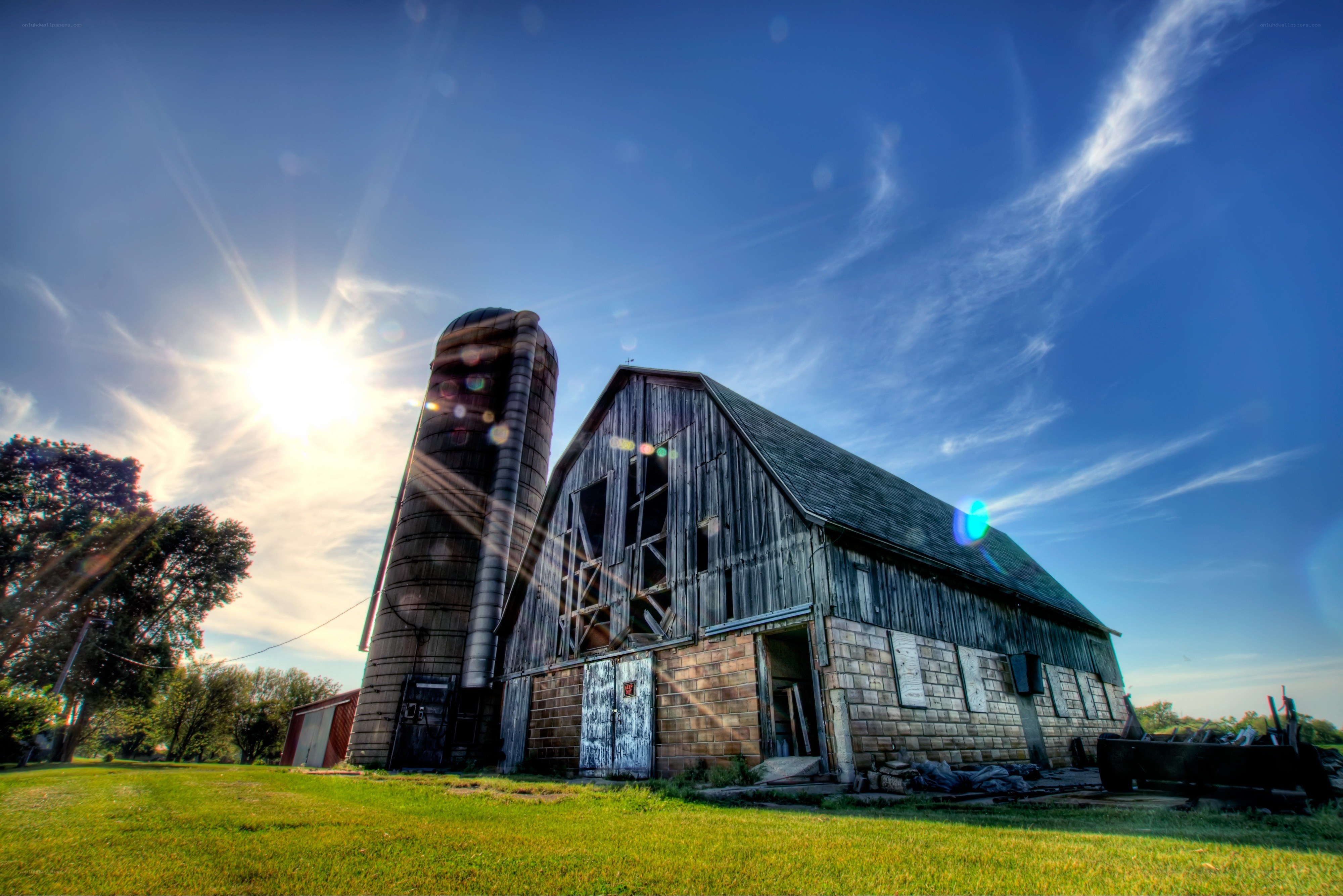 Old barn and silo at sunset