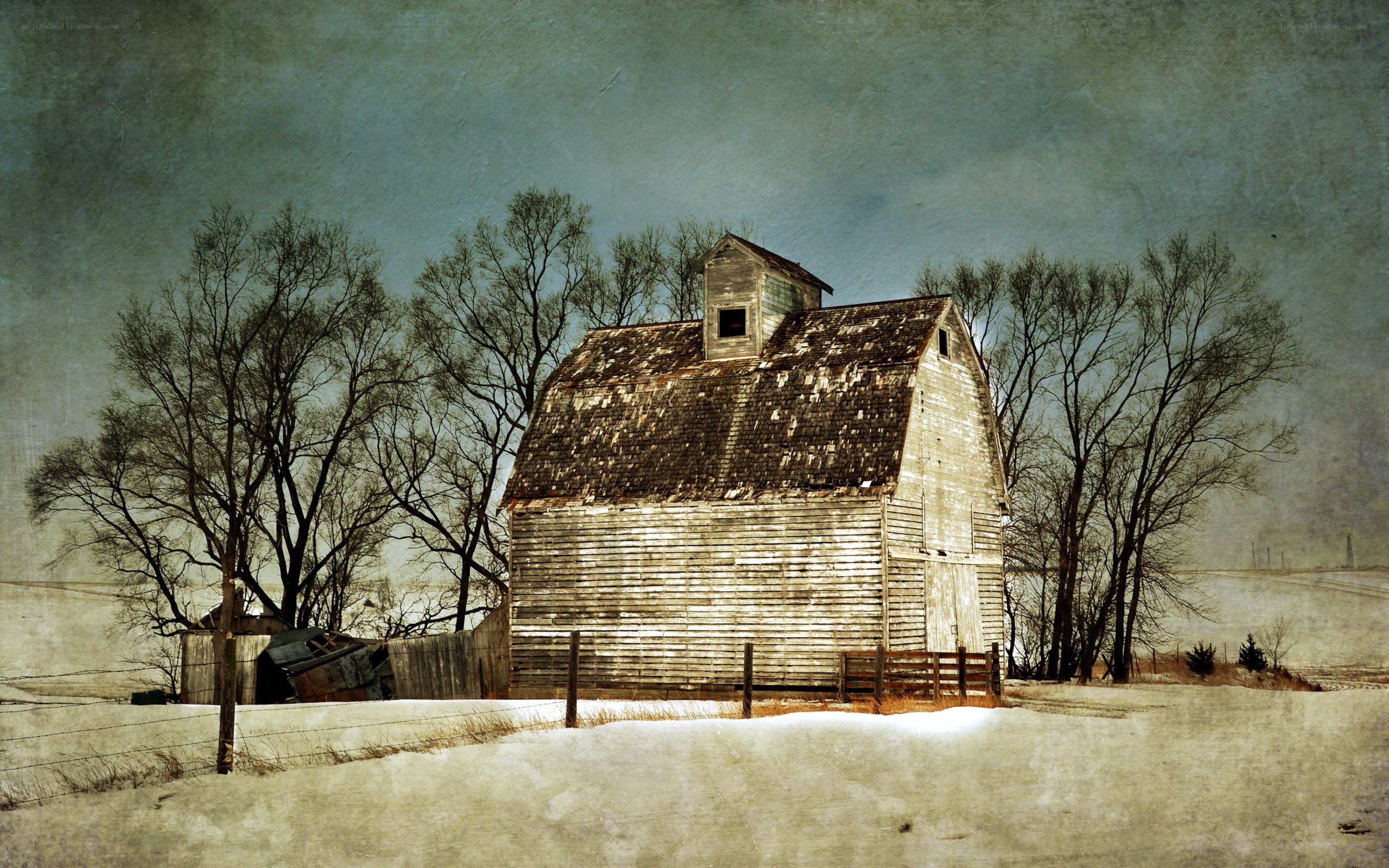 Old barn in snowy landscape