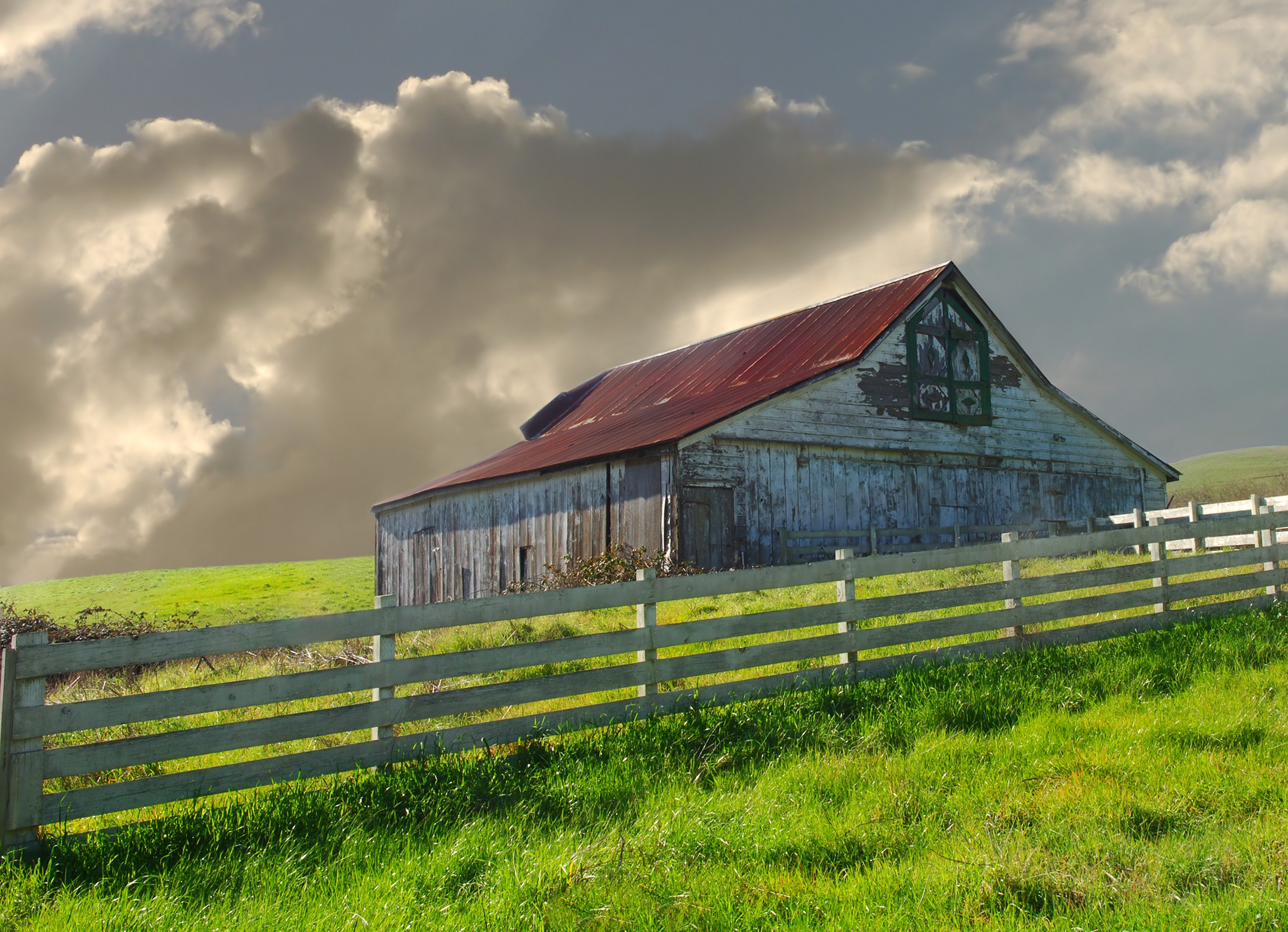 Old barn on a green hill