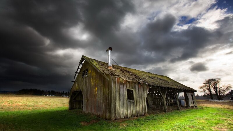 Old barn under stormy sky
