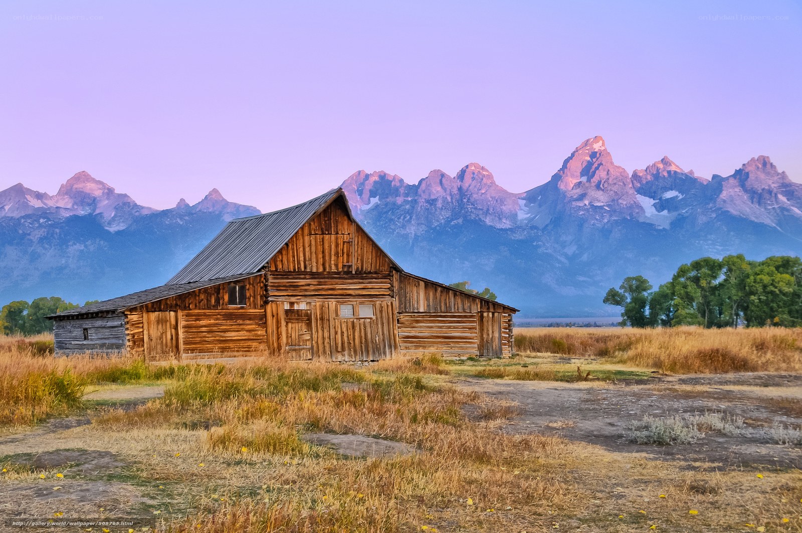Old barn with mountain backdrop