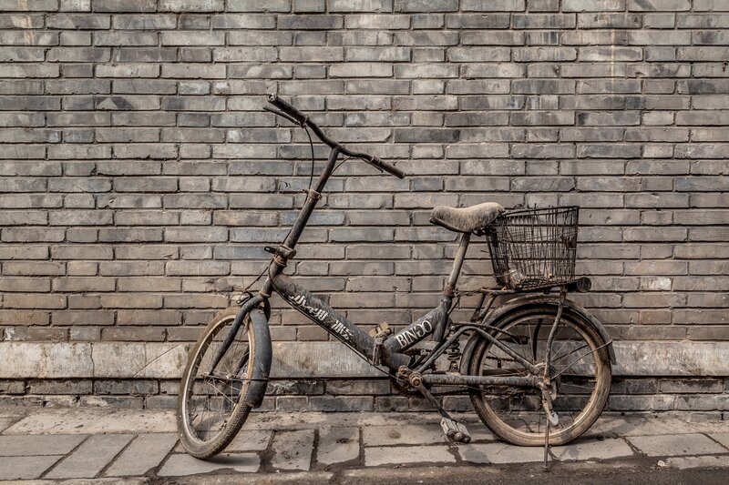 Old Bicycle Against Wall