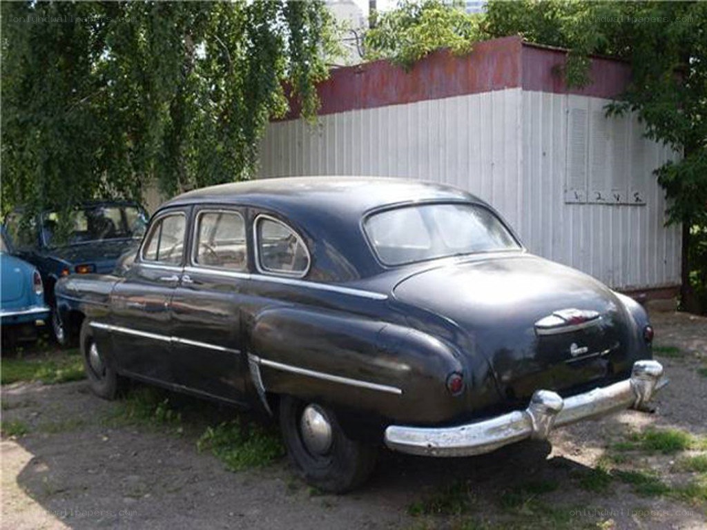 Old black car parked outside