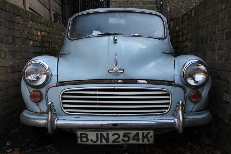 Old blue car in alley