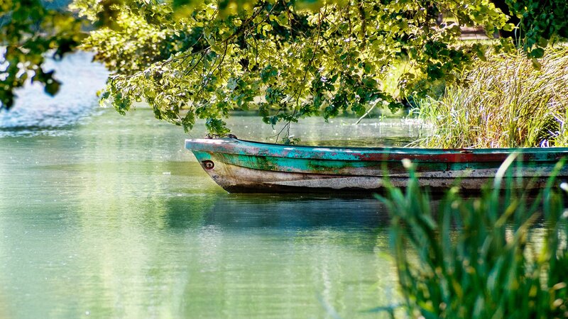 Old boat on a calm river