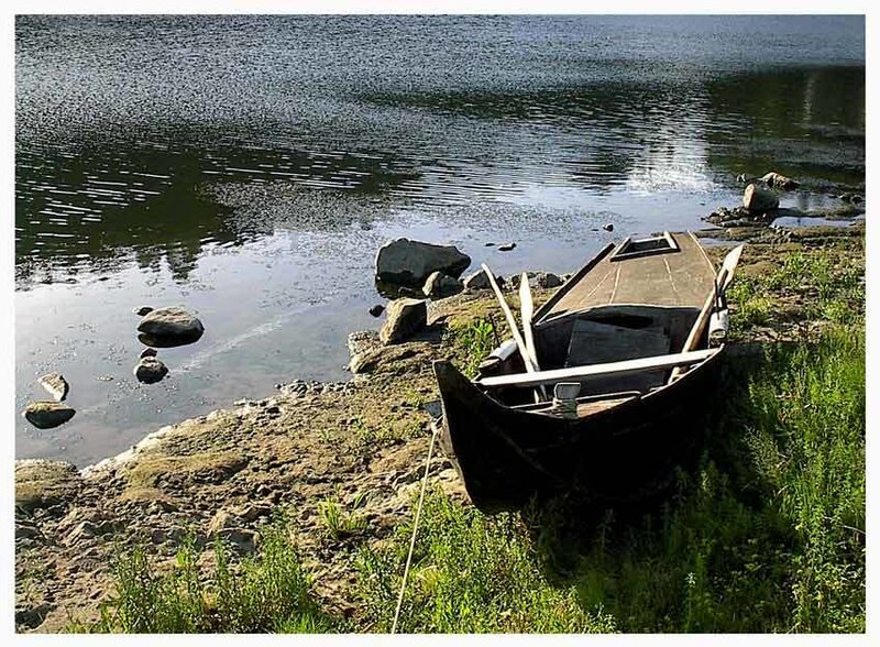 Old boat on a lakeshore
