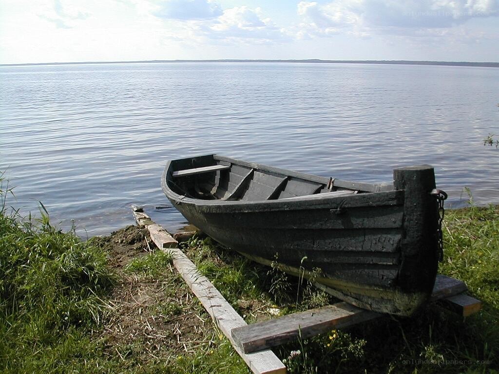 Old boat on a lakeshore