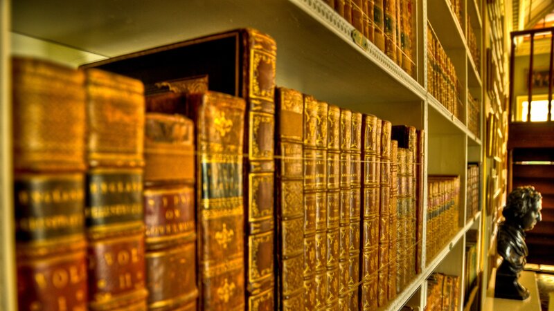 Old Books on Shelves