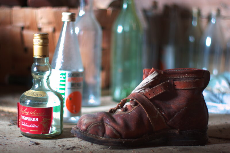 Old boot and liquor bottles