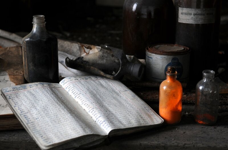 Old bottles and notebook on a table
