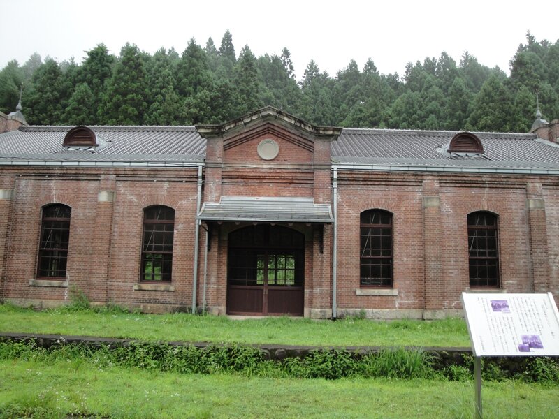 old brick building in forest