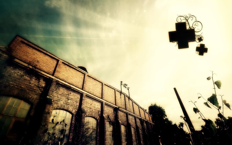 Old brick building with cross sign