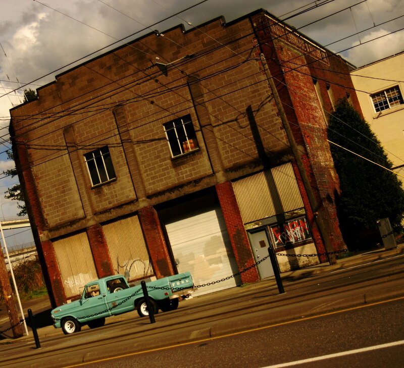 Old brick building with vintage truck
