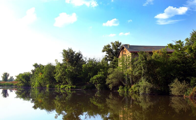 Old Building by River — Blue