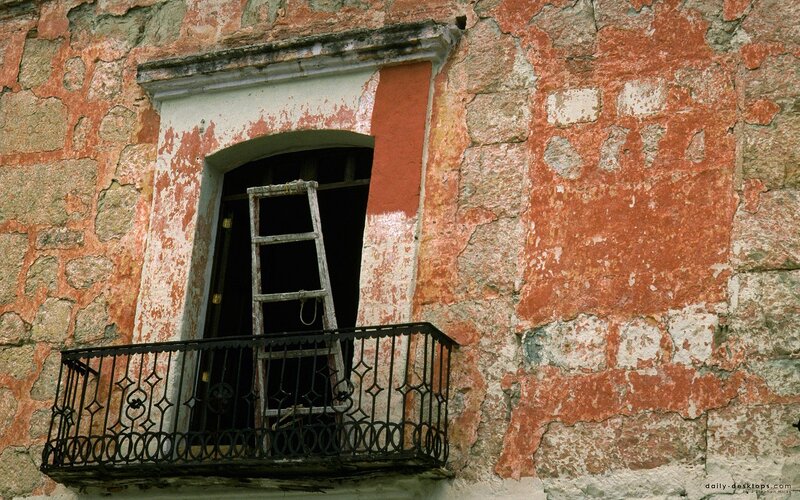 Old building with ladder in window