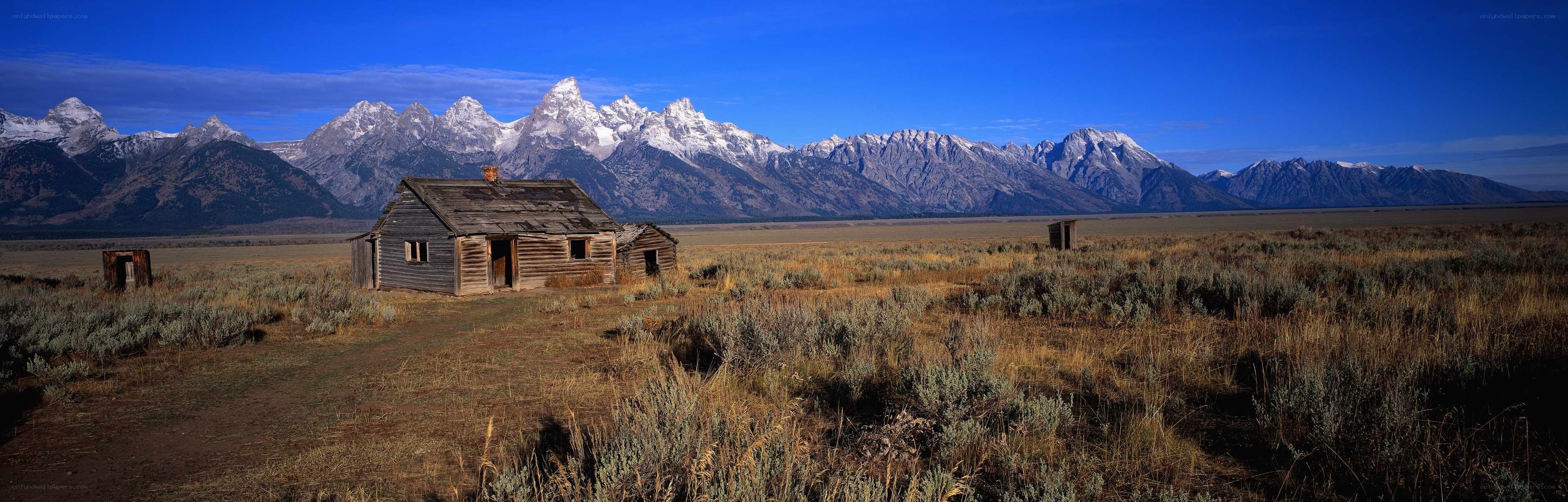 Old cabin in mountain valley