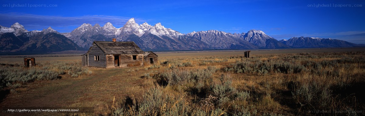 Old cabin in mountain valley