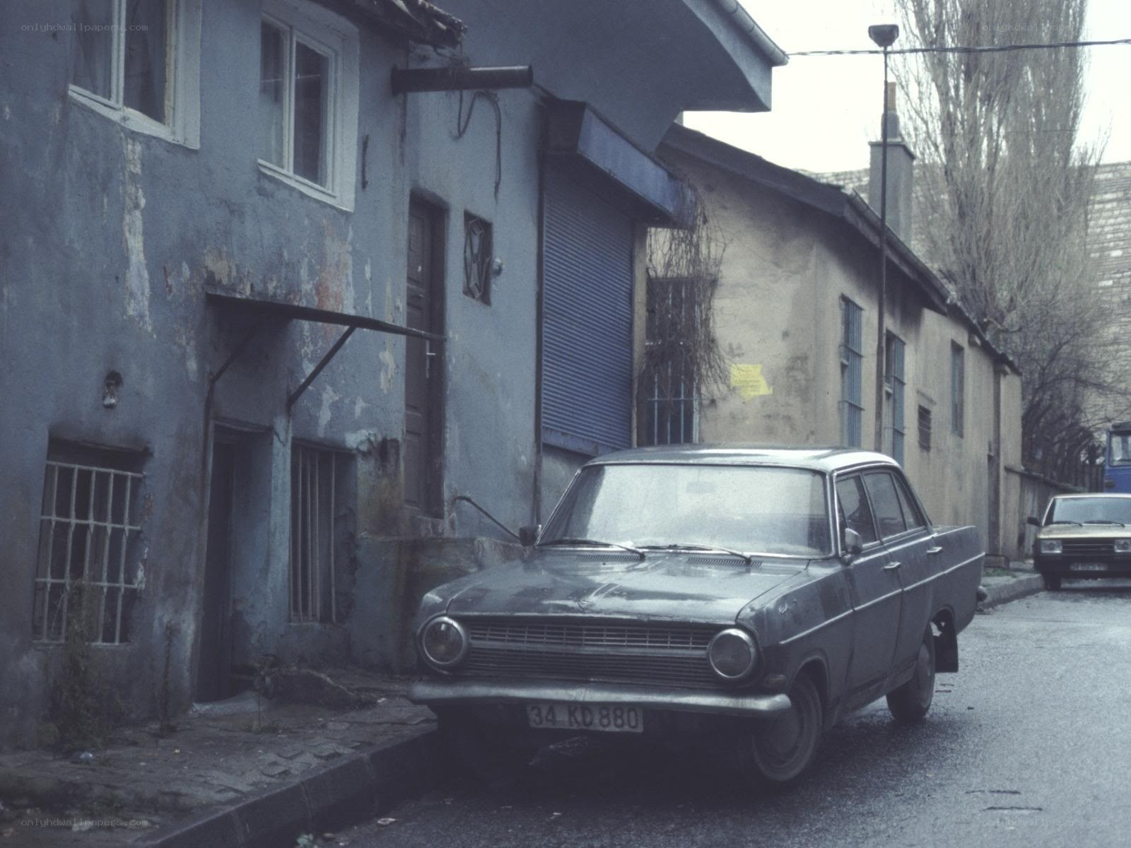 Old car in a narrow street